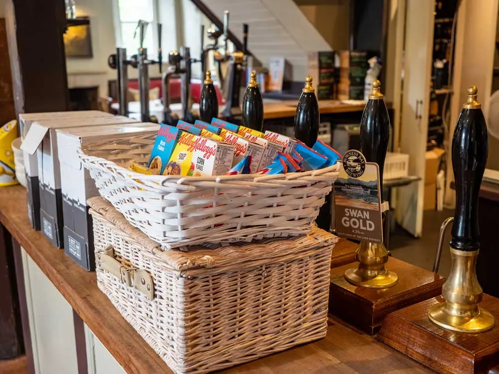 The bar with beer pumps and baskets of snacks