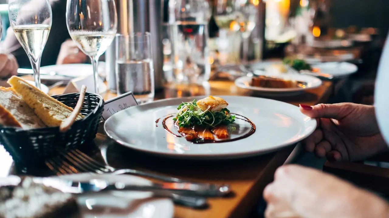 A table laid with pub food and drinks