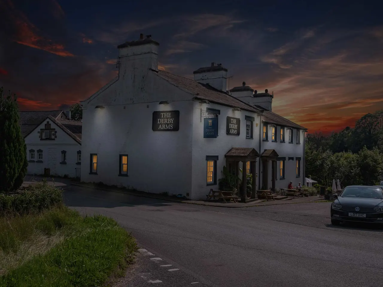 The Derby Arms glowing at dusk