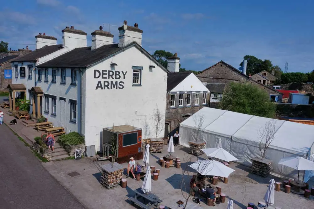 The Derby Arms and its outdoor seating area in Witherslack